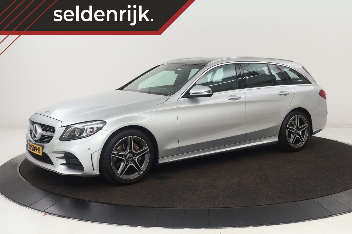 Mercedes-Benz C-Klasse 180 AMG | Panoramadak | Leder | Stoelverwarming | Carplay | Matrix LED | Sfeerverlichting | Camera | Navigatie | Side Assist | Climate control | Park Assist
